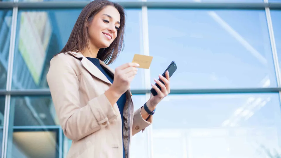 women looking at a credit card