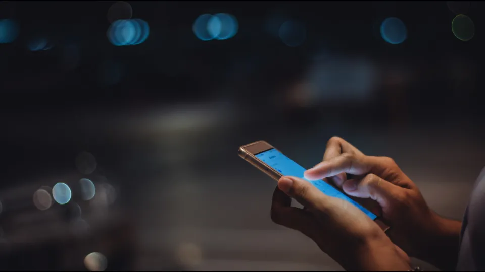 a women holding a mobile phone